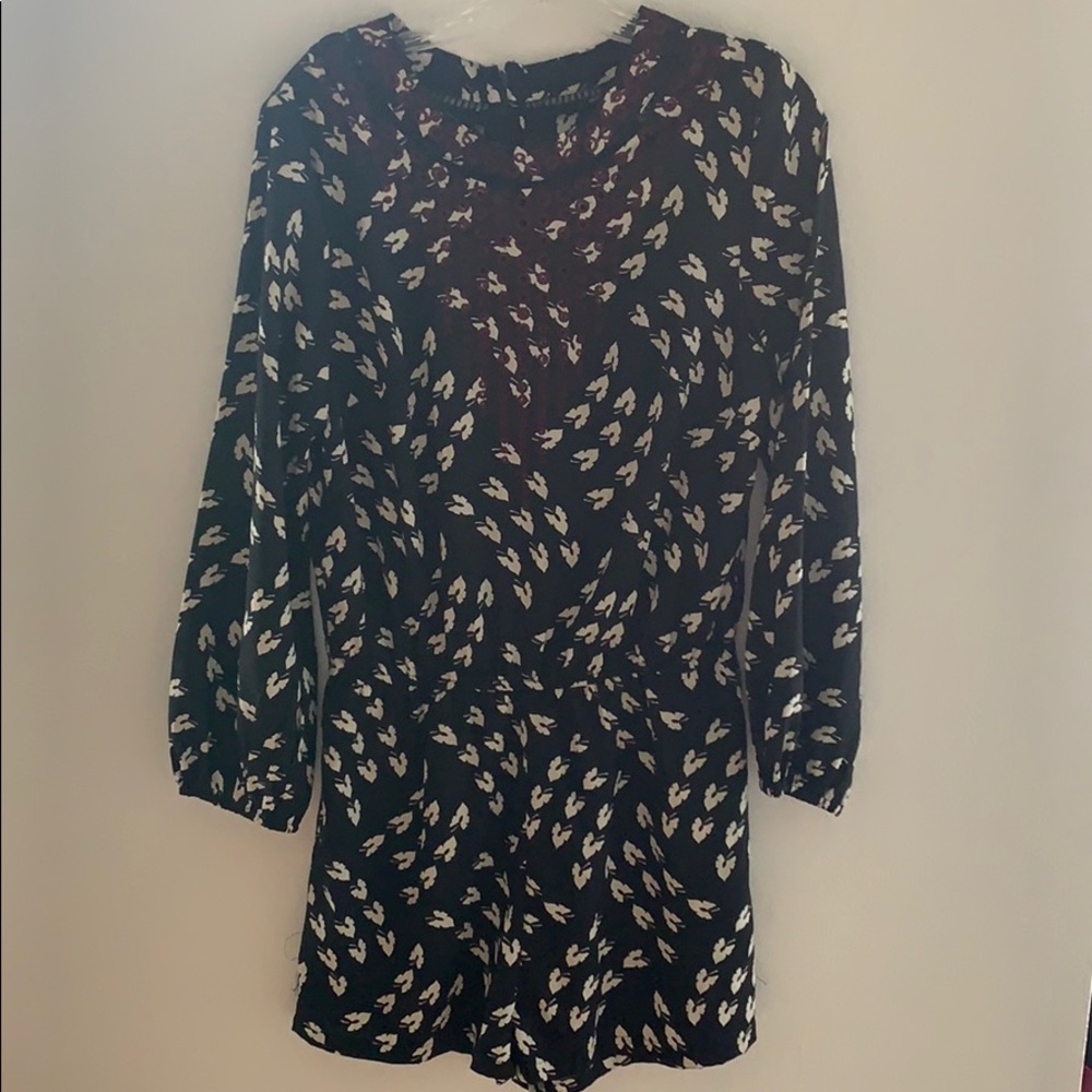 Black and white romper with eyelet detail.